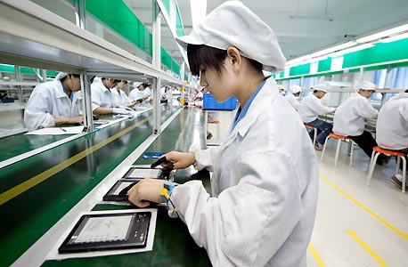 פס ייצור ביצרנית אלקטרוניקה סינית, צילום: אי פי אי