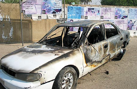 מכונית שרופה בבגדד לאחר תקרית במהלכה הרגו אנשי בלקווטר 9 אזרחים, צילום: MCT