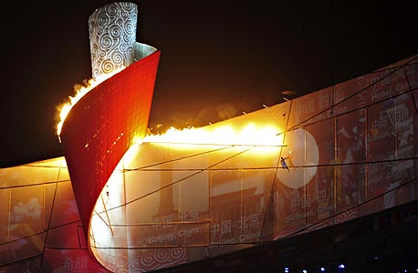 לי נינג, מדליק הלפיד האולימפי, צילום: בלומברג