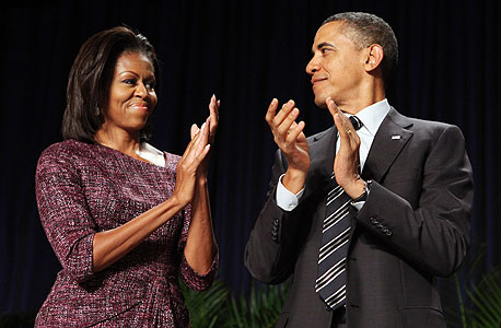 נשיא ארה"ב ברק אובמה ואשתו מישל, צילום: בלומברג