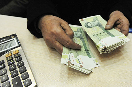 הריאל האיראני. צנח מול הדולר, צילום: בלומברג