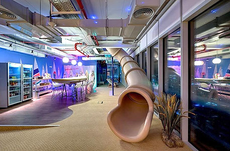 A slide leading to a furnished dining area at Google's Tel Aviv office. Photo: Itay Sikolski A slide leading to a furnished dining area at Google's Tel Aviv office. Photo: Itay Sikolski