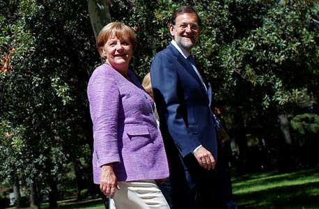ראש ממשלת ספרד מריאנו ראחוי וקנצלרית גרמניה אנגלה מרקל, צילום: רויטרס