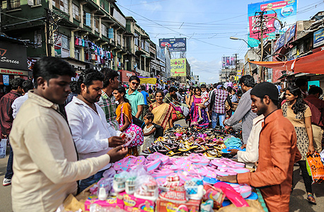 סוחרים בהודו, צילום: בלומברג