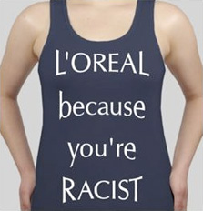 "לוריאל – בגלל שאתם גזעניים". כיתוב מחאה כנגד החברה, המבוסס על הסלוגן שלה (מתוך sott.net)