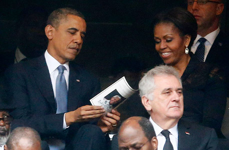 הנשיא ברק אובמה מישל אובמה טקס האשכבה ל נלסון מנדלה, צילום: רויטרס