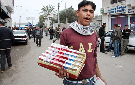 A youth selling cigarettes in Gaza. Photo: Bloomberg