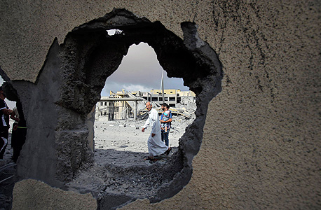 מבנה בעזה שנפגע בהפצצת חיל האוויר, צילום: רויטרס