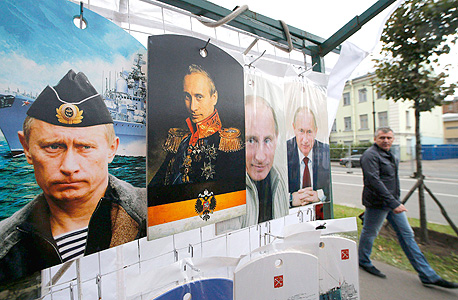 פוסטרים של נשיא רוסיה ולדימיר פוטין בסנט פטרסבורג, צילום: רויטרס
