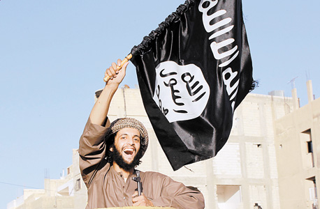 מוסף שבועי 4.9.14 דגל דאעש, צילום: רויטרס