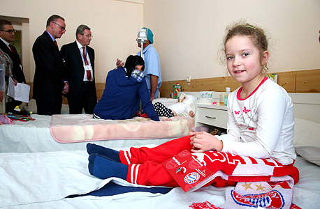 ילדה פצועה בלבייב. ברגע קרל היינץ רומינגה, צילום: אימג