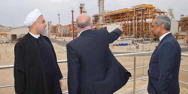 משמאל: נשיא איראן חסן רוחאני ושר הנפט ביג