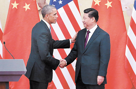 מימין: נשיא סין שי ג'ינפּינג ונשיא ארה"ב ברק אובמה (ארכיון)