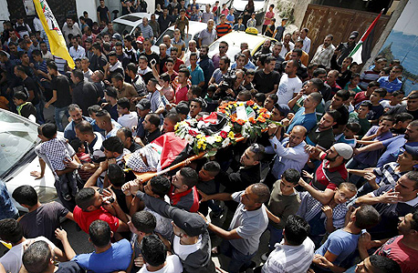 הלוויה של ילד שנהרג בעימותים מול צה"ל בגדה המערבית, צילום: רויטרס