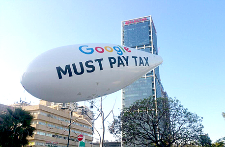 מחאה למען תשלום מסים על ידי גוגל. ה־OECD המליץ על גביית מסים על פעילות דיגיטלית
