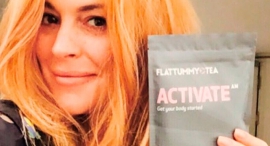 Lindsey Lohan holds up a product on her Instagram post 