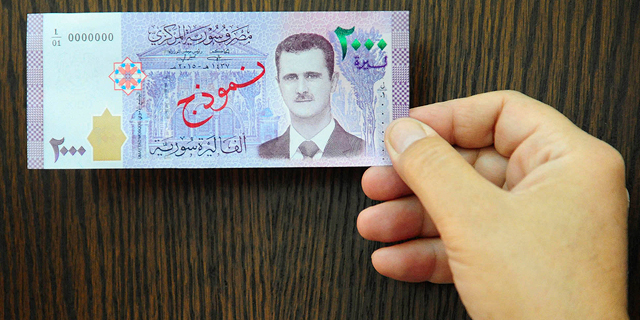 שלא תשכחו מי הנשיא: שטר חדש בסוריה נושא את דיוקנו של אסד