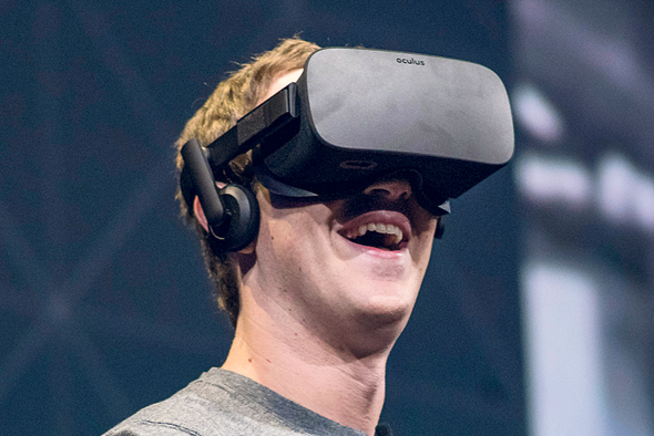Facebook CEO Mark Zuckerberg with the Oculus headset