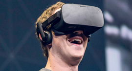 Facebook CEO Mark Zuckerberg with the Oculus headset