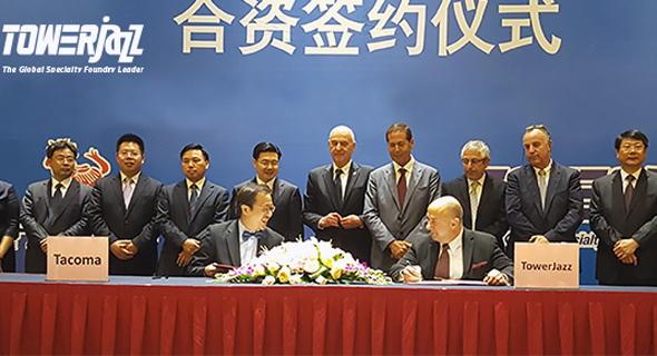 Tacoma chairman Joseph Lee and Tower CEO Russell Ellwanger signing a partnership agreement