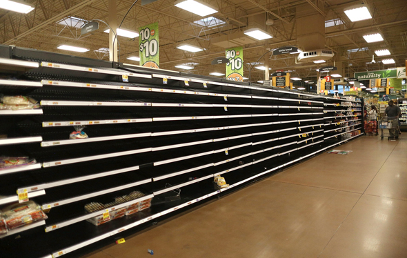 מדפים ריקים בסופרמרקט בטקסס, צילום: איי פי