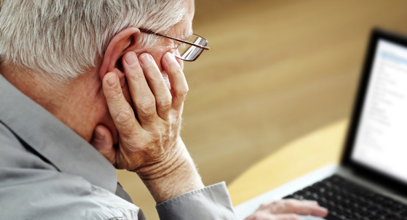 Elderly person using a computer (illustration). Photo: Shutterstock