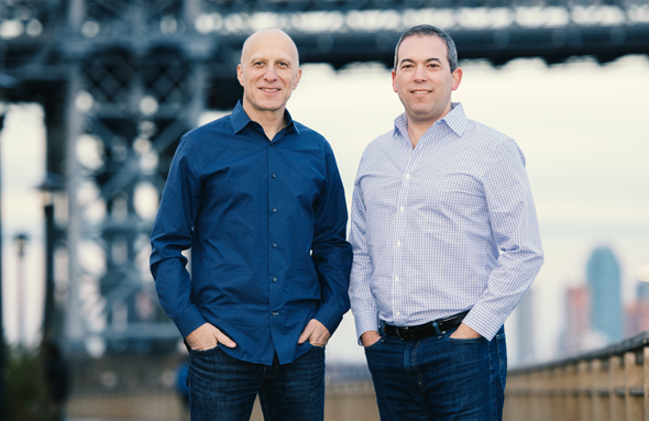 Outbrain co-CEOs David Kostman and Yaron Galai. Photo: Noam Galai