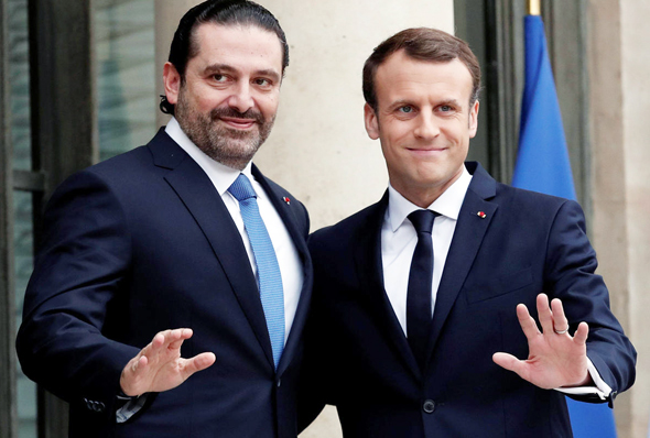 מימין נשיא צרפת עמנואל מקרון ו אל חרירי אתמול ב פריז, צילום: רויטרס