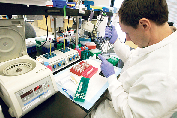 Working in a lab. Photo: Bloomberg