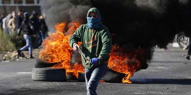 Palestinian protester in Ramalla. Photo: AFP