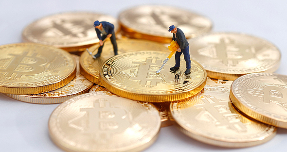Illustrative image of people mininig for Bitcoin. Photo: Shutterstock