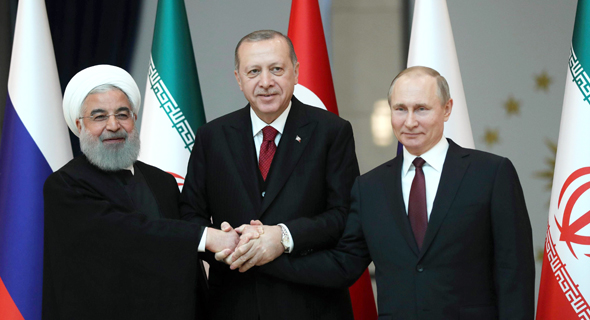 Iranian President Rouhani, Turkish President Erdoğan, and Russian President Putin. Photo: AFP