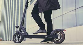 A man riding an electric scooter. Photo: Shutterstock