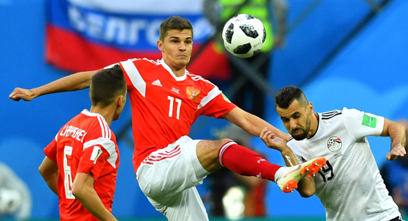 רוסיה נגד מצרים במונדיאל. הבטיחו את מקומם בשמינית הגמר , צילום: רויטרס