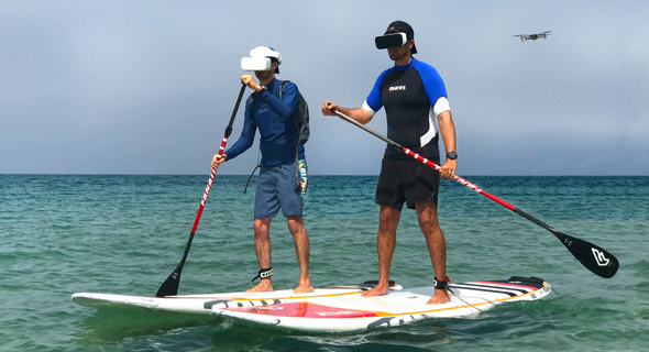 Paddle boarders with AR headsets. Photo: XTend