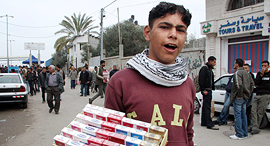 A youth selling cigarettes in Gaza. Photo: Bloomberg