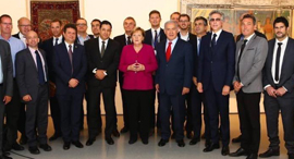 Angela Merkel and men. Photo: Facebook