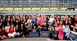   Female Techies with Merkel Cardboard Cutout. Photo: Orel Cohen