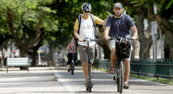 E-bike and E-scooter users in Tel Aviv. Photo: Amit Sha'al 