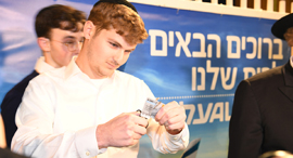 Ultra-Orthodox El Al customers cut frequent flier cards in protest. Photo: Yair Sagi