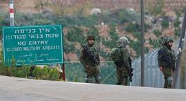 Israeli troops on the Lebanon-Israel border. Photo: AP