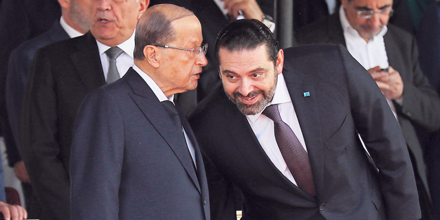ראש ממשלת לבנון סעד אלחרירי (מימין) והנשיא מישל עאון. חיזבאללה ירצה לקבל גם תיקים חברתיים בממשלה החדשה, צילום: AP
