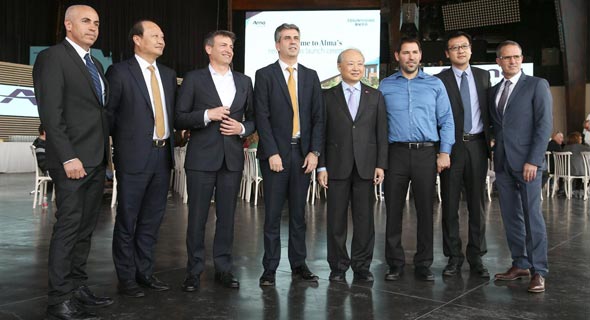 Fosun executives with Israel's Minister of Economy Eli Cohen. Photo: Elad Gershgoran