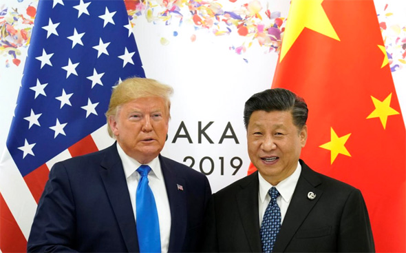 נשיאי ארה"ב וסין. לאחד מהם יש סיבה לחייך