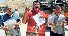 Palestinians demonstrating for the boycott of Israeli goods. Photo: AFP