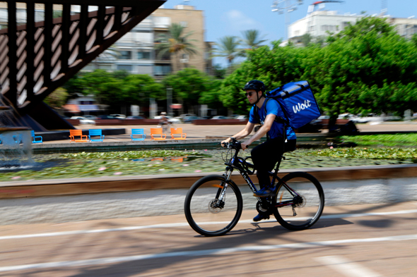 Wolt delivery person in Tel Aviv. Photo: Amit Sha'al