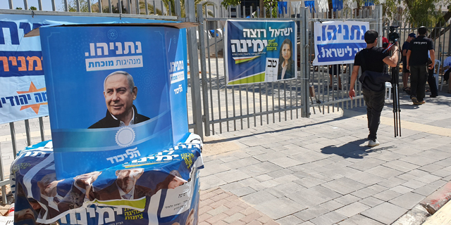 Ads for various right-wing parties outside a polling station in a Jewish settlement in the West Bank. Photo: Amir Kurz