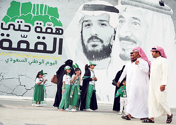 המלך ויורש העצר על כרזה בריאד, סעודיה, צילום: רויטרס