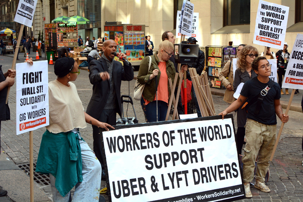 Uber and Lyft drivers protesting their working conditions. Photo: Shutterstock