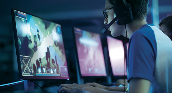 A gamer playing a videogame. Photo: Shutterstock